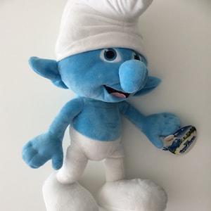 LGQHCE Schtroumpf Poupée, 2 Pièces 35cm Peluche Smurf Animal Poupée Peluche  Dessin Animé Schtroumpfs Peluche Douce Doudou Poupée De Chiffon Plush Toys  Smurf Jouets en Peluche : : Jeux et Jouets