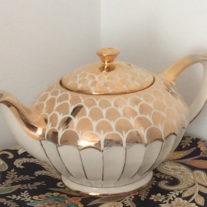 Vintage Sadler Teapot. Oval Shaped Teapot with Gilt top and Gilt lined panels on the bottom.