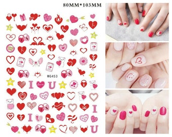 May include: A sheet of nail art stickers with a variety of red and pink hearts, stars, and other designs. The stickers are 80mm by 103mm and are perfect for adding a touch of love to your nails.