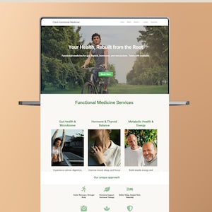 May include: A laptop displays a website for Clara Functional Medicine. The site features a man on a bicycle, text reading "Your Health, Rebuilt from the Root," and sections on gut health, hormones, and metabolism. The site offers telehealth.