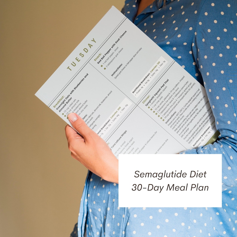 May include: A close-up of a printed sheet of paper with a 30-day meal plan titled "Semaglutide Diet 30-Day Meal Plan". The meal plan includes a list of foods for each day of the week, including breakfast, snack, nutrition break, and dinner.