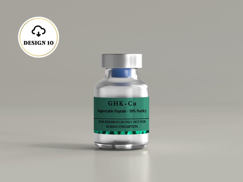 May include: A clear glass vial with a silver cap and a blue stopper, featuring a green label with the text GHK-Cu, Injectable Peptide - 99% Purity, and FOR RESEARCH USE ONLY. NOT FOR HUMAN CONSUMPTION. The label has a geometric pattern at the bottom.