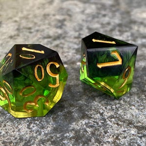 Handmade resin dice, green with black smoke and gold numbers, these are one of our most popular gifts.