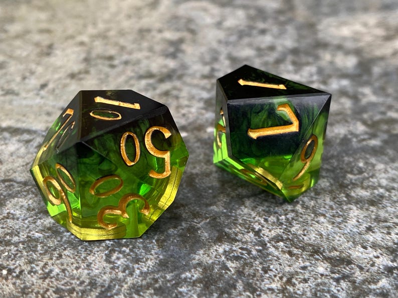 Handmade resin dice, green with black smoke and gold numbers, these are one of our most popular gifts.