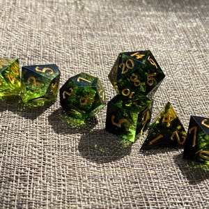 Handmade resin dice, green with black smoke and gold numbers, these are one of our most popular gifts.
