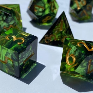 Handmade resin dice, green with black smoke and gold numbers, these are one of our most popular gifts.