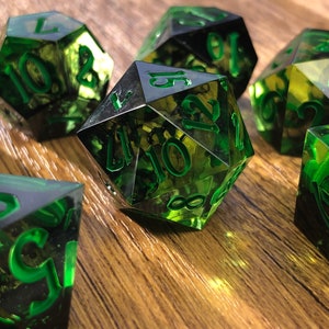 Handmade resin dice, green with black smoke and gold numbers, these are one of our most popular gifts.