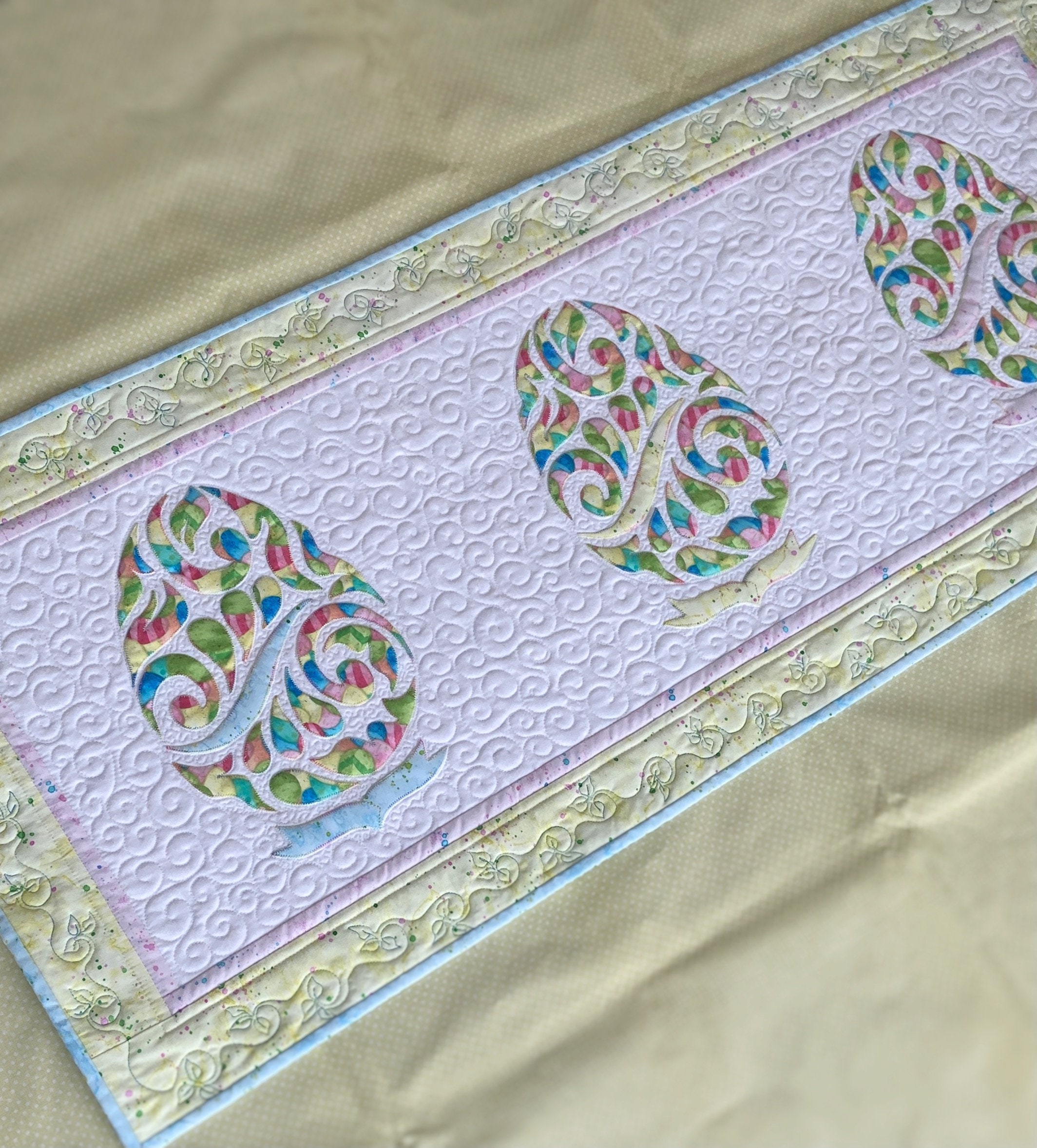 Easter Centerpiece Easter Quilted Table Runner Decorated with eggs Scarf on the dresser in pastel colors