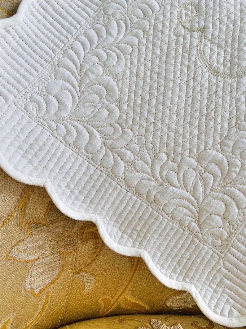 Monogrammed white quilted placemat on the bedside table or Etsy