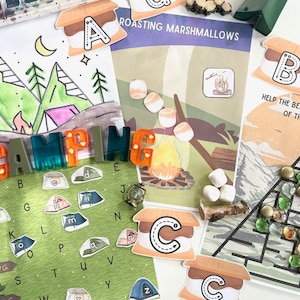 May include: A set of colorful camping-themed educational materials for kids. The set includes a printable coloring page with a camping scene, a printable alphabet chart with camping-themed images, a printable game board with a bear climbing a mountain, and a set of letter tiles that spell out the word "CAMPING".