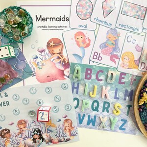 May include: A mermaid-themed learning activity set with colorful alphabet tiles, a dice game, and a printable activity sheet with the text "Mermaids printable learning activities created by Homeschooling Little."