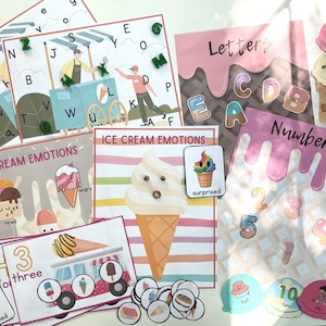 May include: A set of printable educational flashcards featuring ice cream cones with different emotions, letters, and numbers. The flashcards are colorful and feature a variety of ice cream flavors and toppings.
