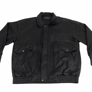 May include: A black leather bomber jacket with a zipper closure, two large pockets, and a ribbed waistband.