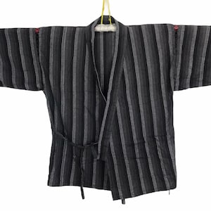 May include: A black and gray striped kimono with a tie belt. The kimono has a traditional Japanese style.