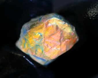 9.80 Carats, Blood Fire Moonstone Rough: Red-Orange Flash (13x11x11 MM)