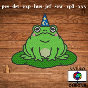 May include: A green frog wearing a blue wizard hat with stars and a crescent moon sits on a green lily pad. The background is a woodgrain pattern. The text "NAT 20 DESIGNS" is at the bottom of the image.