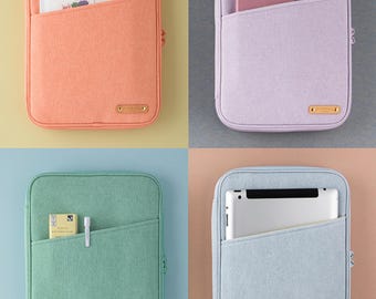 May include: Four zippered tablet cases in different colors: peach, lavender, light green, and light blue. Each case has a zipper closure and a large pocket on the front. The cases are shown with different items inside, such as a notebook, a tablet, and a pen.