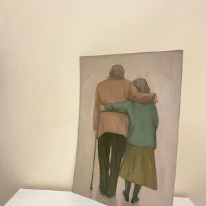 May include: A painting depicting an elderly couple walking hand-in-hand. The man is wearing a brown jacket and the woman is wearing a green jacket and a brown skirt. They are both looking ahead.