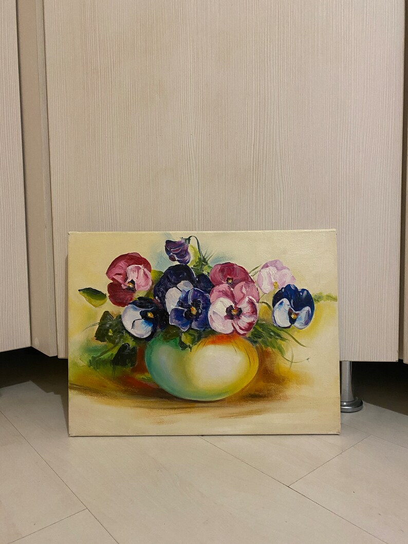 May include: A painting of a bouquet of purple, pink, and white pansies in a green vase. The pansies are arranged in a loose, natural style, and the vase is simple and elegant.