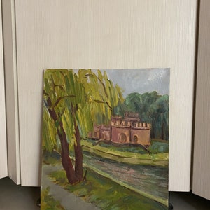 May include: A painting depicting a red brick building with a moat and a weeping willow tree in the foreground. The painting is executed in a loose, impressionistic style.
