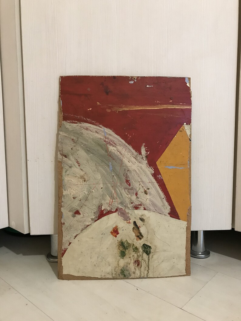 May include: Abstract painting on a wooden panel with red, yellow, white, and green paint. The painting has a geometric shape in the upper right corner and a circular shape in the lower center.