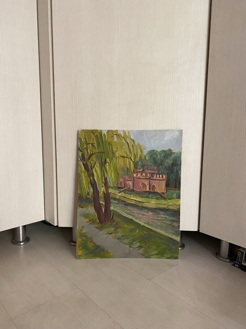 May include: A painting depicting a red brick building with a moat and a weeping willow tree in the foreground. The painting is executed in a realistic style with visible brushstrokes.