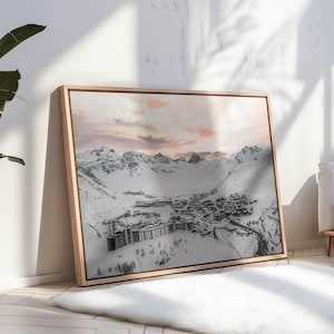 Snowy French Alps artwork with ski resort buildings in alpine home interior