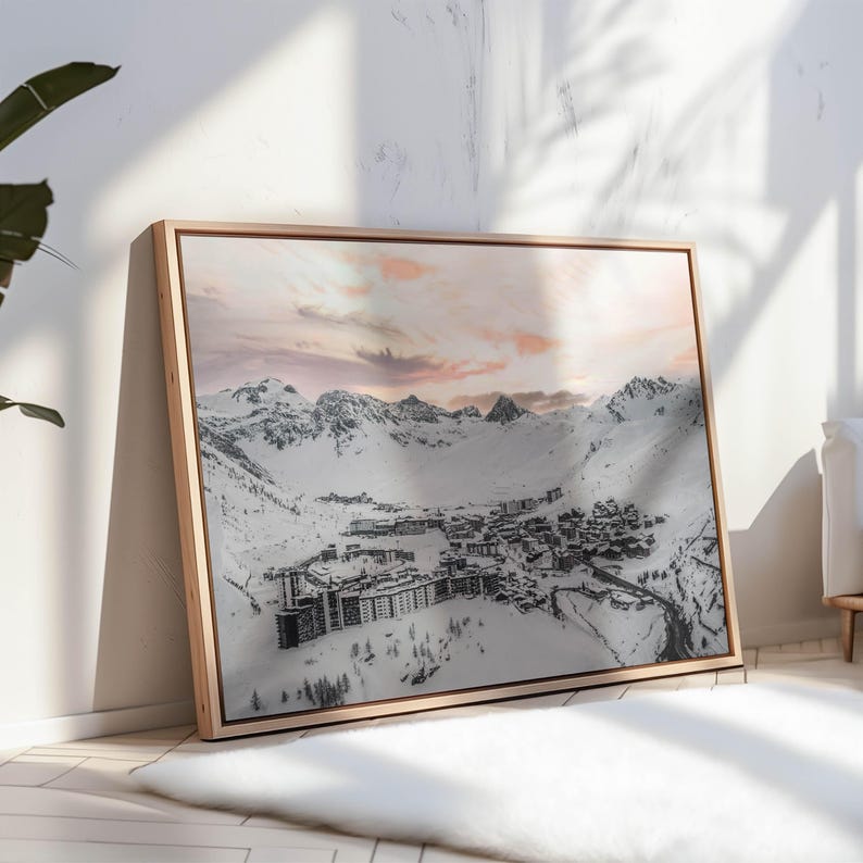 Snowy French Alps artwork with ski resort buildings in alpine home interior