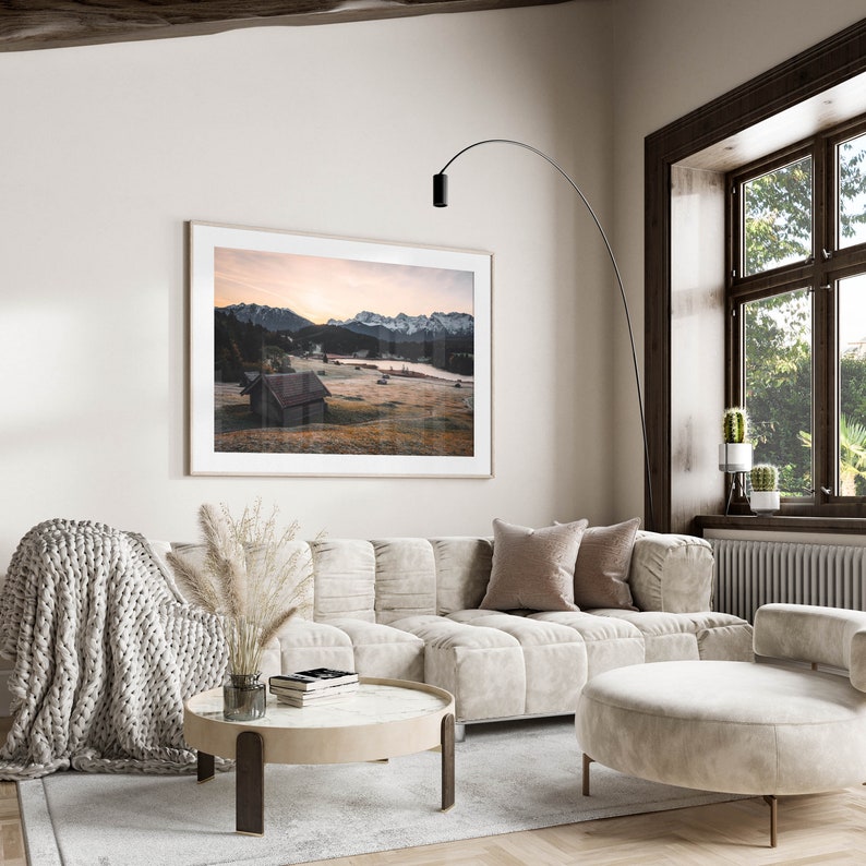 Room adorned with a framed image of scenic Geroldsee landscape.