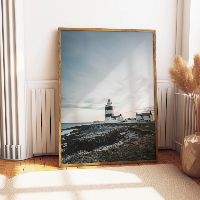 a picture of a lighthouse on a wall in a room