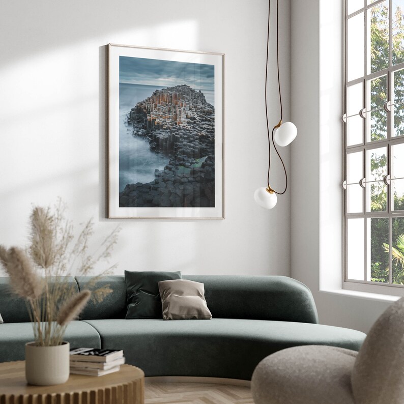 Minimalist room featuring The Giants Causeway in a framed photo.