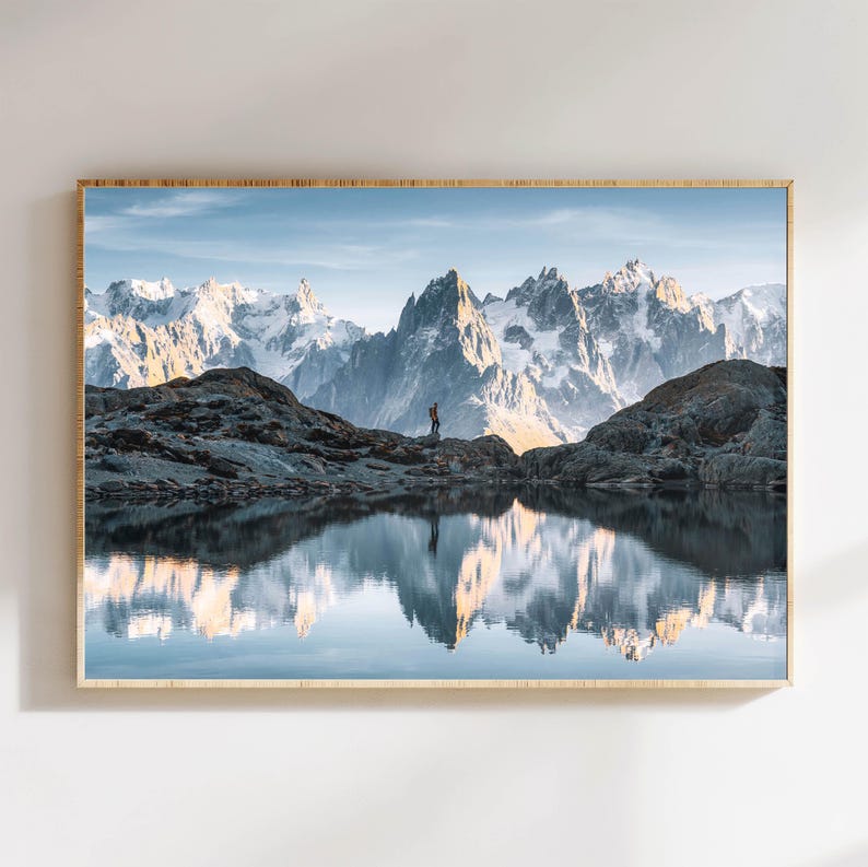 a picture of a mountain range with a lake in the foreground