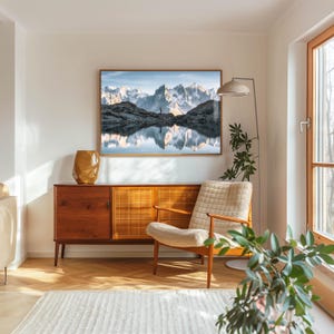 a living room with a painting on the wall