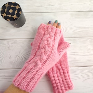 Pink fingerless mittens with a pattern