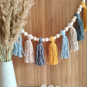 Boho yarn tassel garland with wood. Macrame wall decor