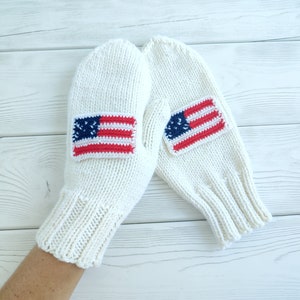 Knitted white mittens for women with the US flag made of merino wool
