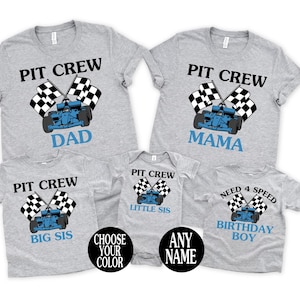 May include: A collection of gray t-shirts and a onesie with racing-themed designs. Each shirt features a race car, checkered flags, and the words "PIT CREW" or "NEED 4 SPEED". The shirts are labeled "DAD", "MAMA", "BIG SIS", "LITTLE SIS", and "BIRTHDAY BOY".