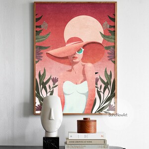 May include: A digital illustration of a woman wearing a large, wide-brimmed pink hat and sunglasses. The woman is standing in front of a red and orange sunset with green foliage and pink flowers.