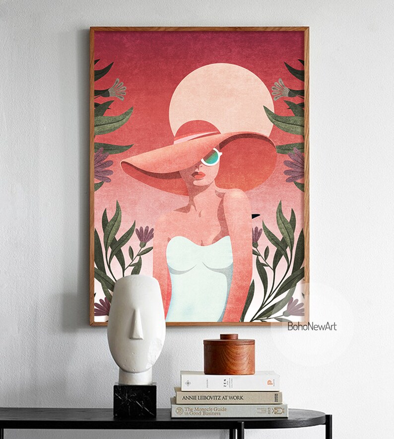May include: A digital illustration of a woman wearing a large, wide-brimmed pink hat and sunglasses. The woman is standing in front of a red and orange sunset with green foliage and pink flowers.