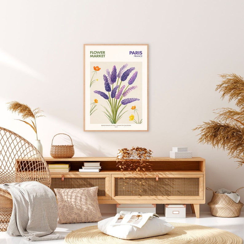 May include: A botanical illustration print featuring a bouquet of purple flowers with yellow and orange accents. The print is framed and has the text "FLOWER MARKET PARIS FRANCE" at the top.