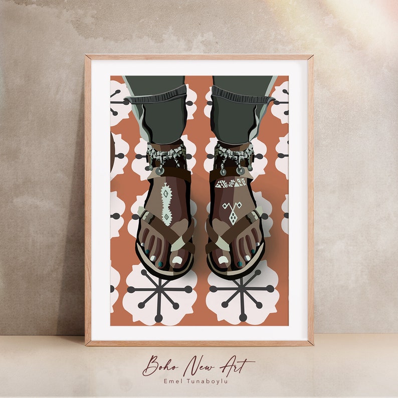 May include: Illustration of feet wearing brown sandals with decorative patterns and ankle bracelets. The artwork is set against a patterned background of white and orange flowers. The framed print is labeled "Boho New Art" and the artist's name.