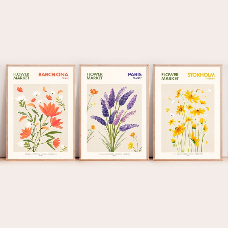 May include: Three illustrated posters with floral designs. Each poster features a different city name and country: Barcelona, Spain; Paris, France; and Stockholm, Sweden. The posters have a vintage aesthetic and feature a floral bouquet in the center of each poster.