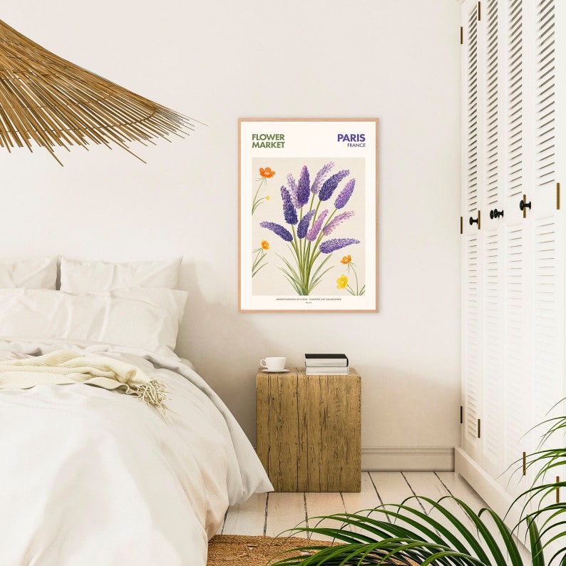 May include: A framed botanical illustration of purple lavender flowers with yellow and orange wildflowers. The print has the text "Flower Market" and "Paris, France" at the top.