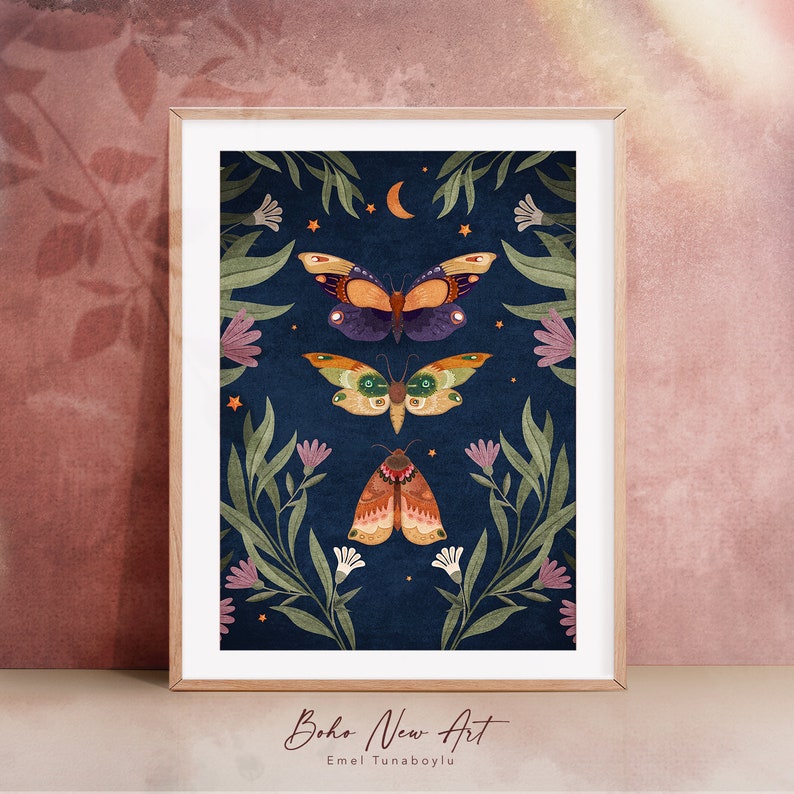 May include: A digital art print featuring three moths with intricate patterns on their wings, surrounded by stylized flowers and leaves on a dark blue background. The print has a bohemian aesthetic and includes the text "Boho New Art" and "Emel Tunaboylu".