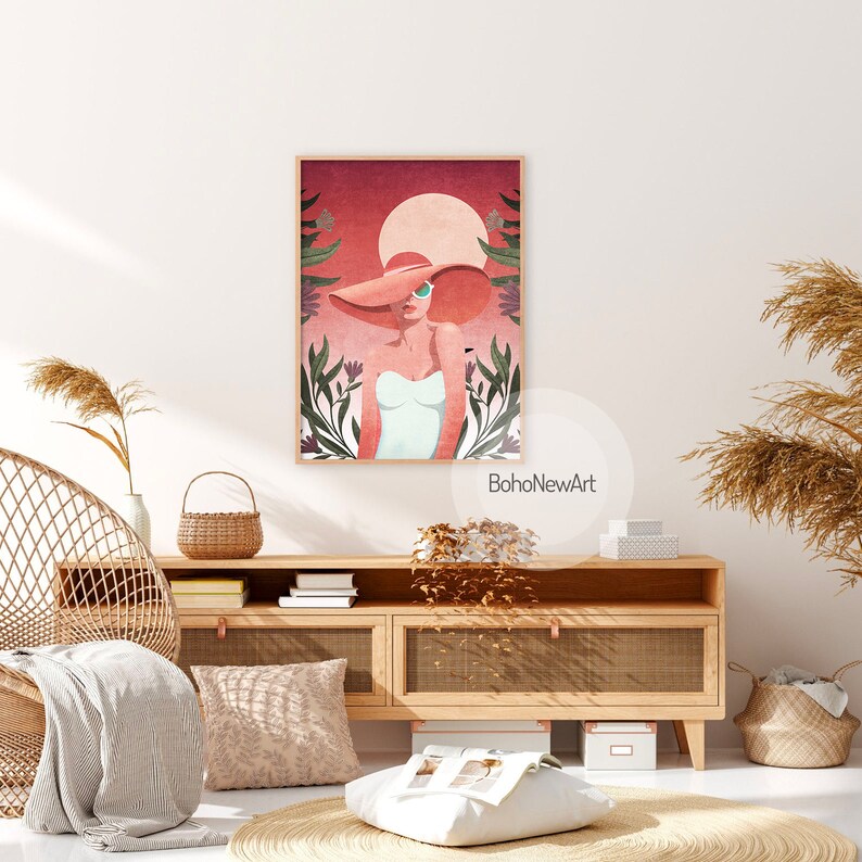 May include: A digital illustration of a woman wearing a large, pink sun hat and sunglasses. She is standing in front of a red sunset with green foliage.