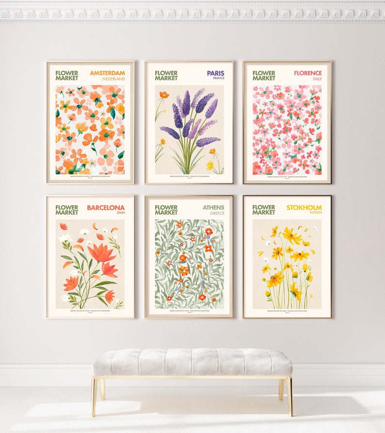May include: A set of six illustrated posters featuring floral designs and the names of cities around the world, including Amsterdam, Paris, Florence, Barcelona, Athens, and Stockholm. Each poster has a different floral design and the city name and country are listed below the flower.