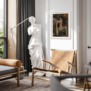 May include: A white plaster statue of a woman standing in a living room with a brown leather armchair, a gray sofa, and a framed painting of a woman with a cigarette hanging from her lips. The painting is titled "BOHO NEW ART".