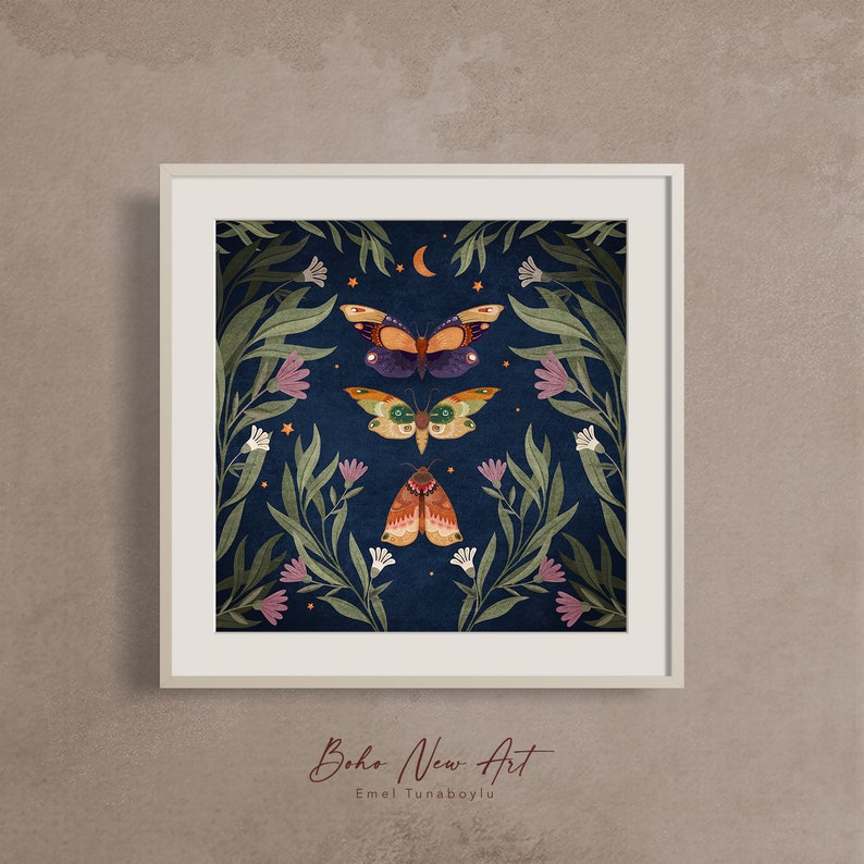 May include: A framed illustration of three moths with intricate wings against a dark blue background. The moths are surrounded by green leaves and white and pink flowers. The text "Boho New Art" and "Emel Tunaboylu" is at the bottom of the image.