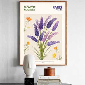 May include: A framed botanical illustration of purple and lavender flowers with orange and yellow flowers in the background. The text "FLOWER MARKET" and "PARIS FRANCE" is at the top of the image.