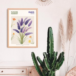 May include: A framed botanical illustration of purple flowers with green stems and leaves. The illustration is titled "Flower Market, Paris, France".